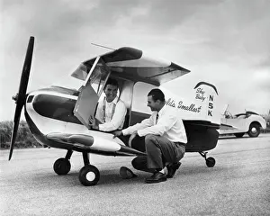 Chino: Designer Ray Stits Kneeling by and Test-Pilot Bob ( Robe?