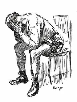 Despairing: Despairing man with his head in his hands