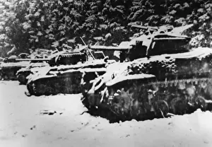Towed: Destroyed American Sherman tank in the Ardennes, 1944