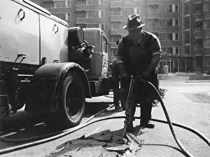 Tarmac: Digging up the tarmac on a road