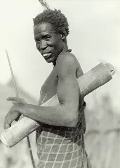 Ethnological: Dinka with Babusroll for transporting small things