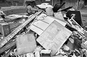 Menu: Discarded rubbish pile with children playing