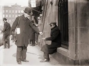 Helpless: Disfigured beggar receiving change on a ?