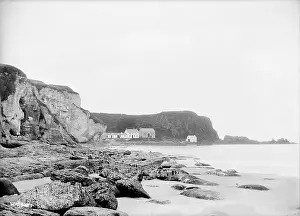 Portbraddon: Distant view of Portbraddon from along the coastline