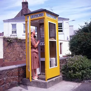 Alan Greeley Collection: Distinctive Yellow Telephone Box - Jersey, Channel Islands
