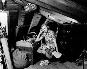 Lovelorn: Distraught Looking Young Woman in Attic Reading through