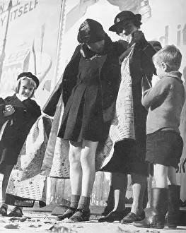Distressed: Distributing cloaks supplied by American Red Cross