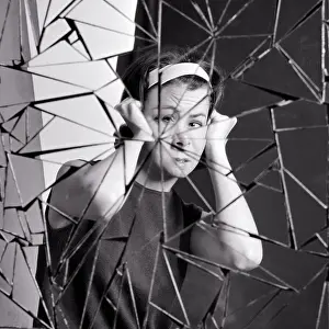 Shards: Disturbed Woman Looking at Camera Holding Head