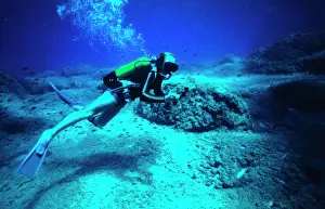 Canisters: Diver on the seabed off the coast of Malta