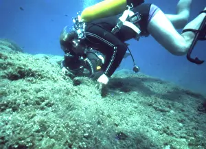 Canisters: Diver on the seabed off the coast of Malta