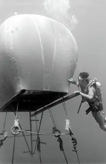 Canister: Diver with underwater house off the coast of Malta
