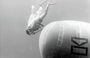 Canister: Diver with underwater house off the coast of Malta