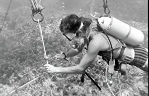 Shackle: Diver with underwater house off the coast of Malta