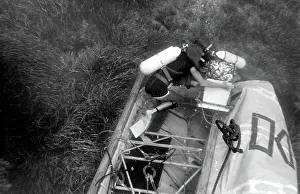 Tangled: Diver with underwater house off the coast of Malta