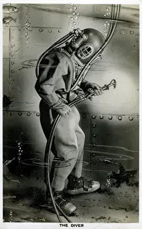 Welds: Diver working on the hull of a ship underwater