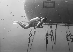 Shoals: Divers with underwater house off the coast of Malta