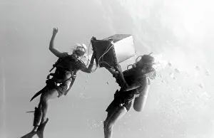 Canister: Divers underwater off the coast of Malta