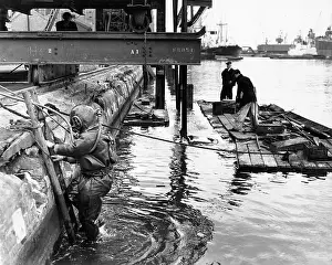 Robin Adler: Dockside scene with men on a raft, London
