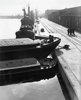 Robin Adler: Dockside scene with vessels and cranes, London