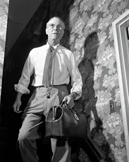 Providers: Doctor with Bag and Stethoscope Walking Down Stairs