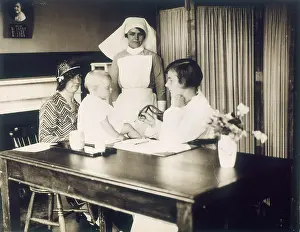 Dispensary: DOCTOR EXAMINES BABY