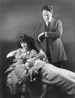 Thirtysomething: Doctor taking the pulse of a sick man
