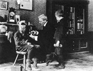 Treating: Doctor Treating Boy, 1900