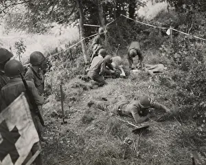 Detectors: Doctors and medics giving first aid to a combat