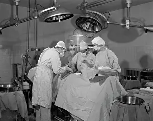 Sterile: DOCTORS IN OPERATING ROOM OPERATING ON PATIENT
