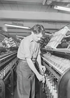 Removing: A doffer working at the William Skinner and