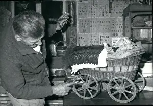 Spite: Doll's pram with doll in Peter Muller's museum
