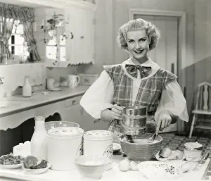 Homemaker: Domestic goddess baking in the kitchen -