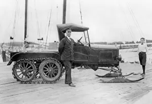 Conventional: Donald Baxter MacMillan next to his tracked vehicle, 1927