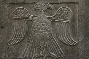Attitude: Double-headed eagle. Relief on a facing slab