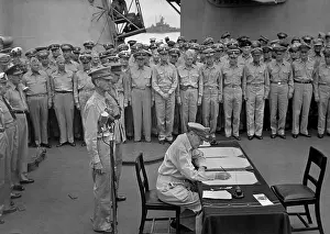 Wainwright: Douglas MacArthur signs documents during Japanese