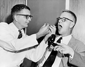 Emory: Dr. Harry L. Williams squirts LSD from a ?
