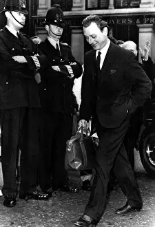 Bobbies: Dr. Stephen Ward on his way to trial at ?