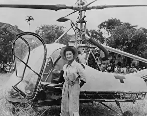 Neurosurgeon: Dr. Valerie Andre, in front of her helicopter in