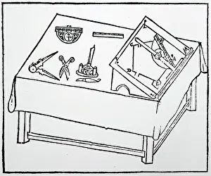Compasses: Drawing table showing a graduated T-square in