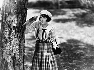 Harmful: Dressed to kill, a young woman with a knife waits