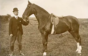 Saddled: Well dressed man with saddled horse