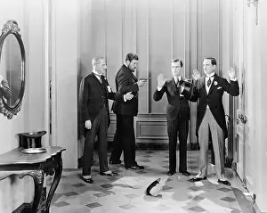 Corridors: Well dressed men being held up with guns by two other men