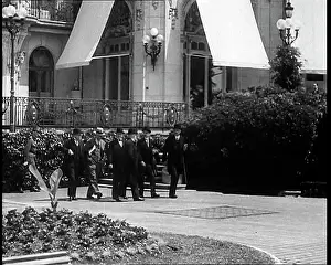 Overcoats: Well Dressed Men in Overcoats Walking Outside