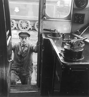 Mans: A Driver Climbing in to his Cab