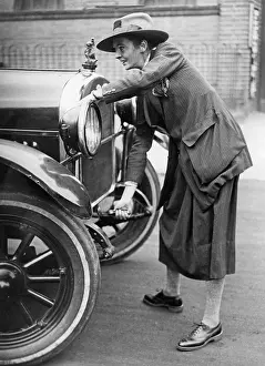 Starts: Driver starting her car, 1927