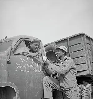 Corridor: Drivers of a U.S. Army truck convoy stops