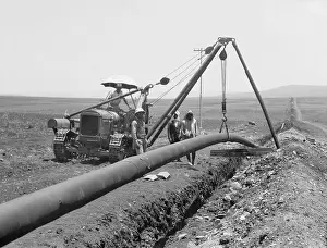 Mideast: Dropping a welded pipe into a trench with ?