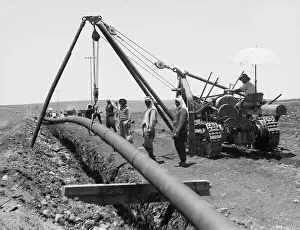 Mideast: Dropping a welded pipe into a trench with ?