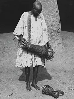Bata: Drummer playing Bata drum. See article by Ulli Beier