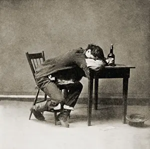 Dissolute: Drunk man with his head on table, 1874. He